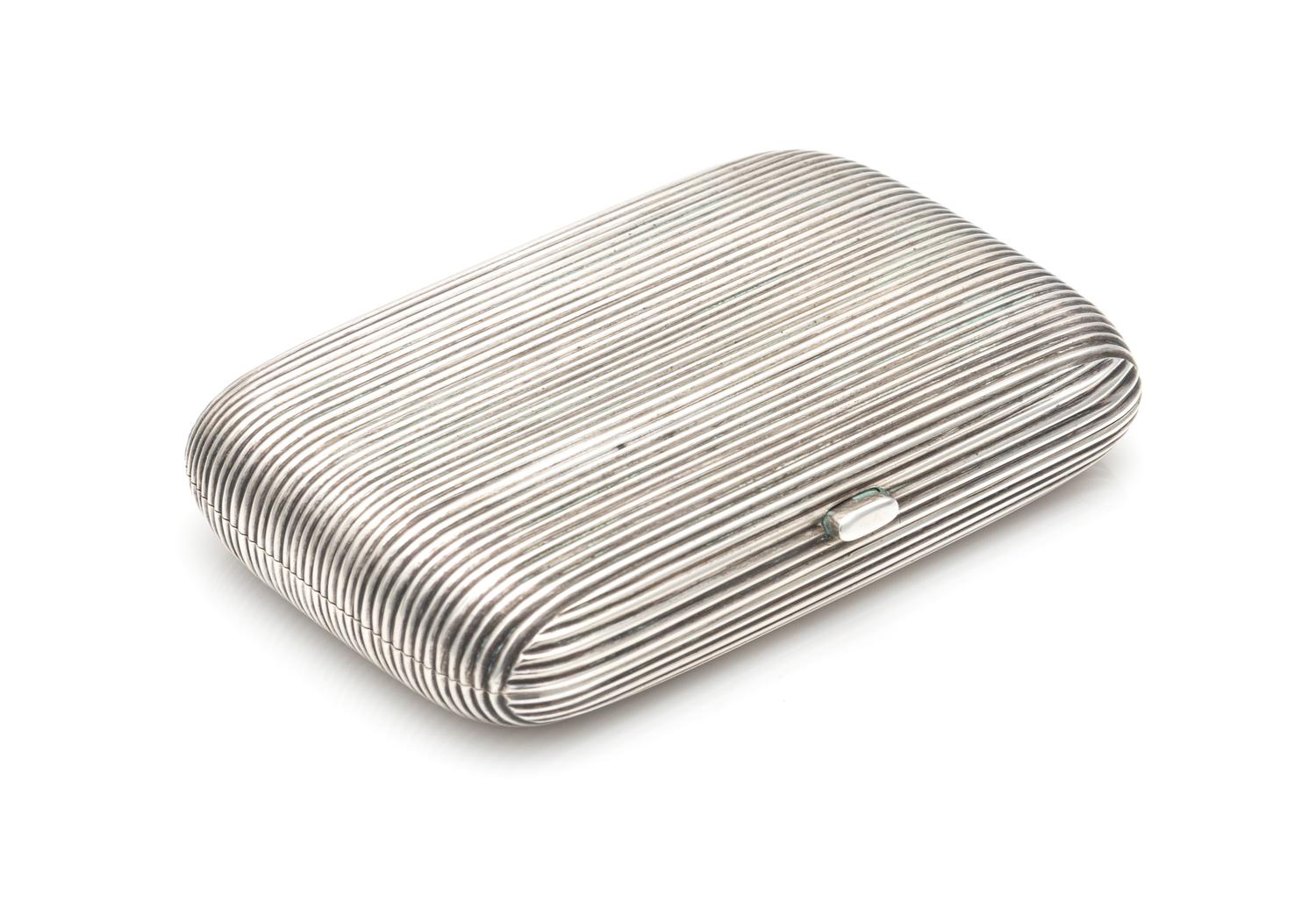 A Russian Silver Cigarette Case, Maker's Mark PJS, St. Petersburg, Late 19th/Early 20th Century, with allover ribbed decoration.