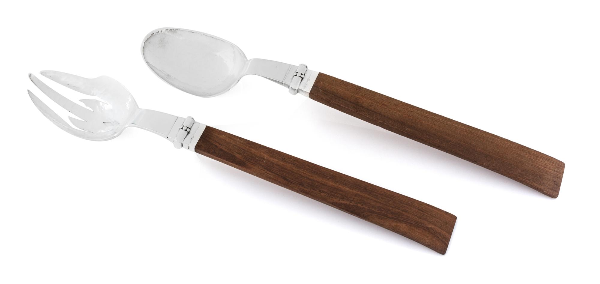 A Mexican Silver Salad Serving Set, William Spratling, Taxco, 1940, comprising a serving spoon and fork with partly spot-hammered bowls