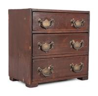 A Stained Pine Miniature Chest of Drawers