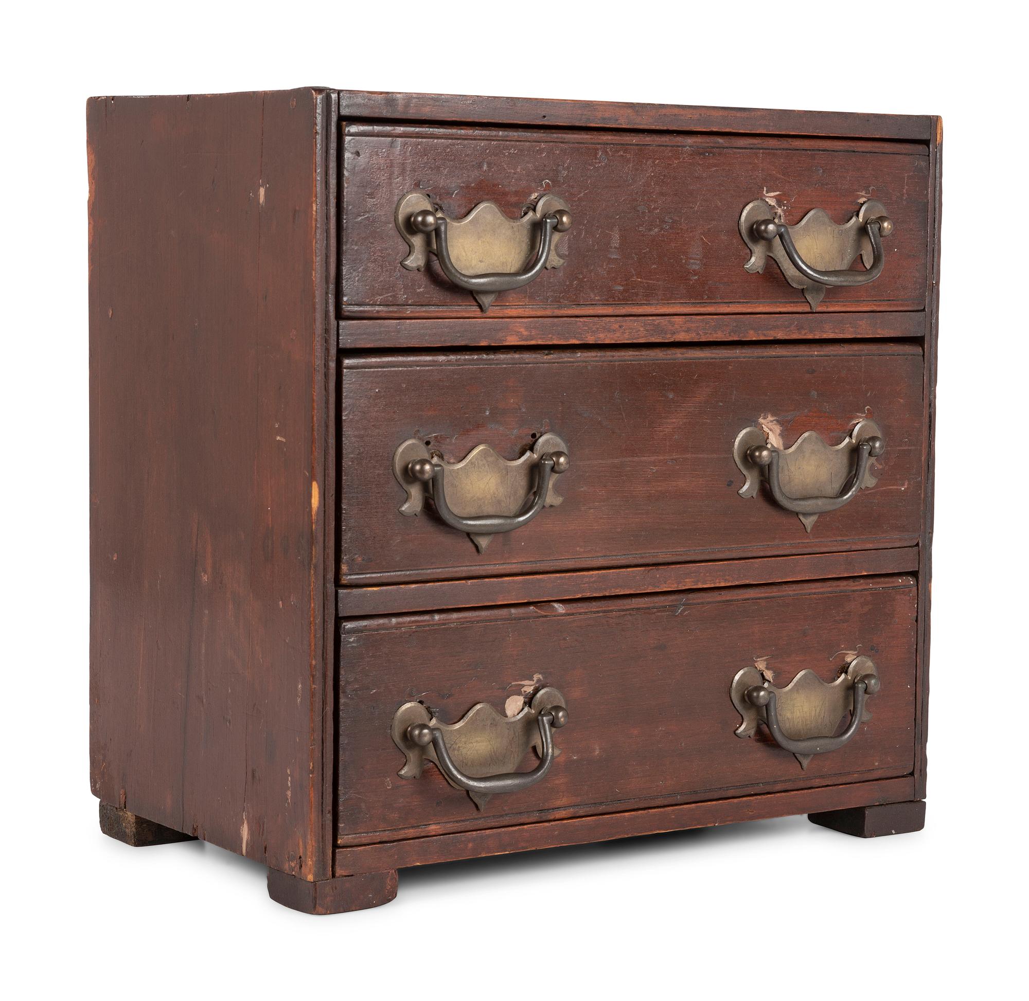 A Stained Pine Miniature Chest of Drawers