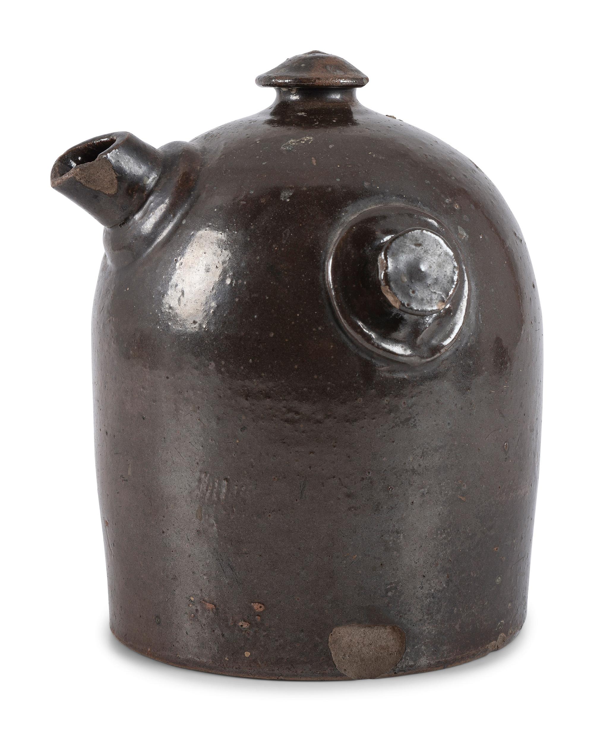 A Scrafitto Incised Albany Slip Stoneware Harvest Jug
