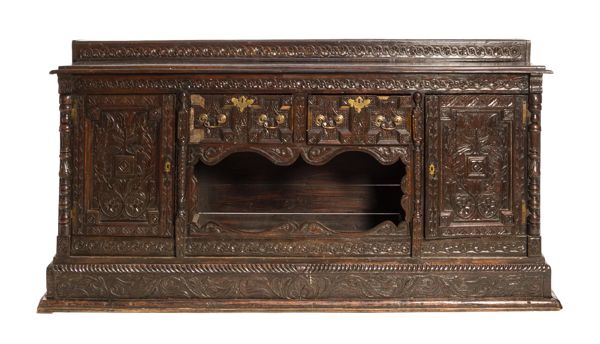 A Renaissance Revival Carved Oak Server Height 79 1/2 x width 82 1/4 x depth 21 inches.