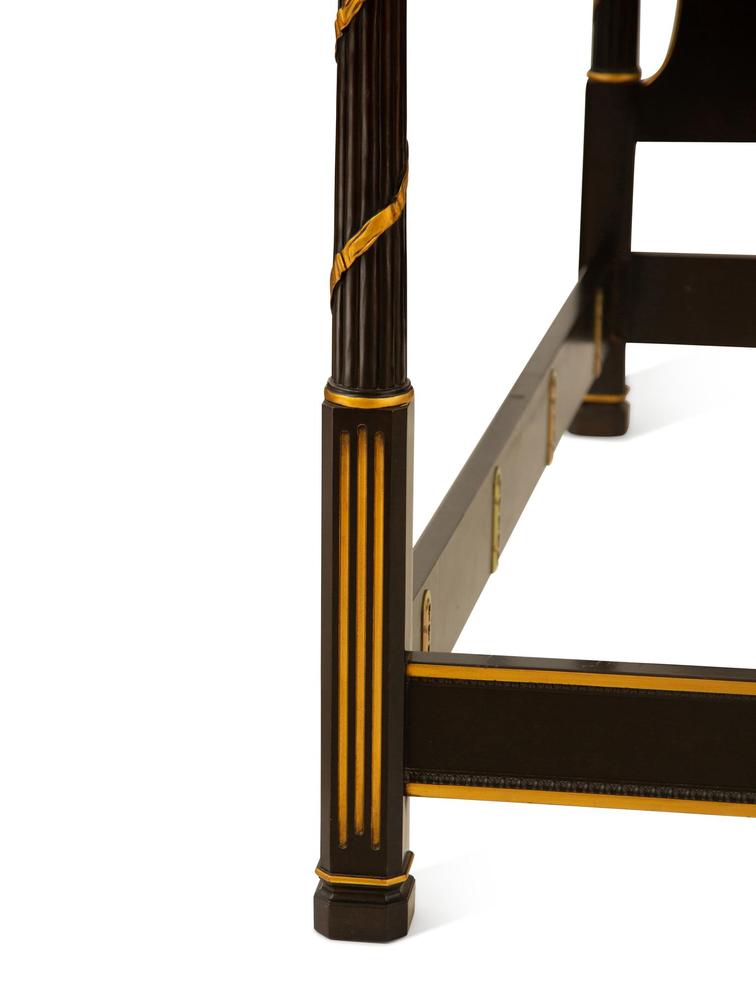A Regency Style Ebonized and Gilt Four-Poster Bed