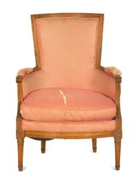 A Louis XVI Carved Walnut Bergère