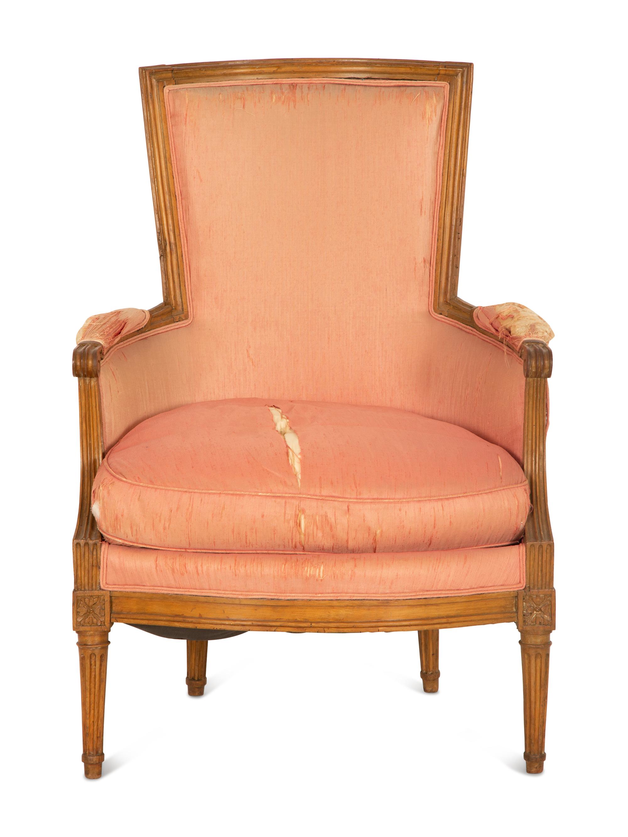 A Louis XVI Carved Walnut Bergère