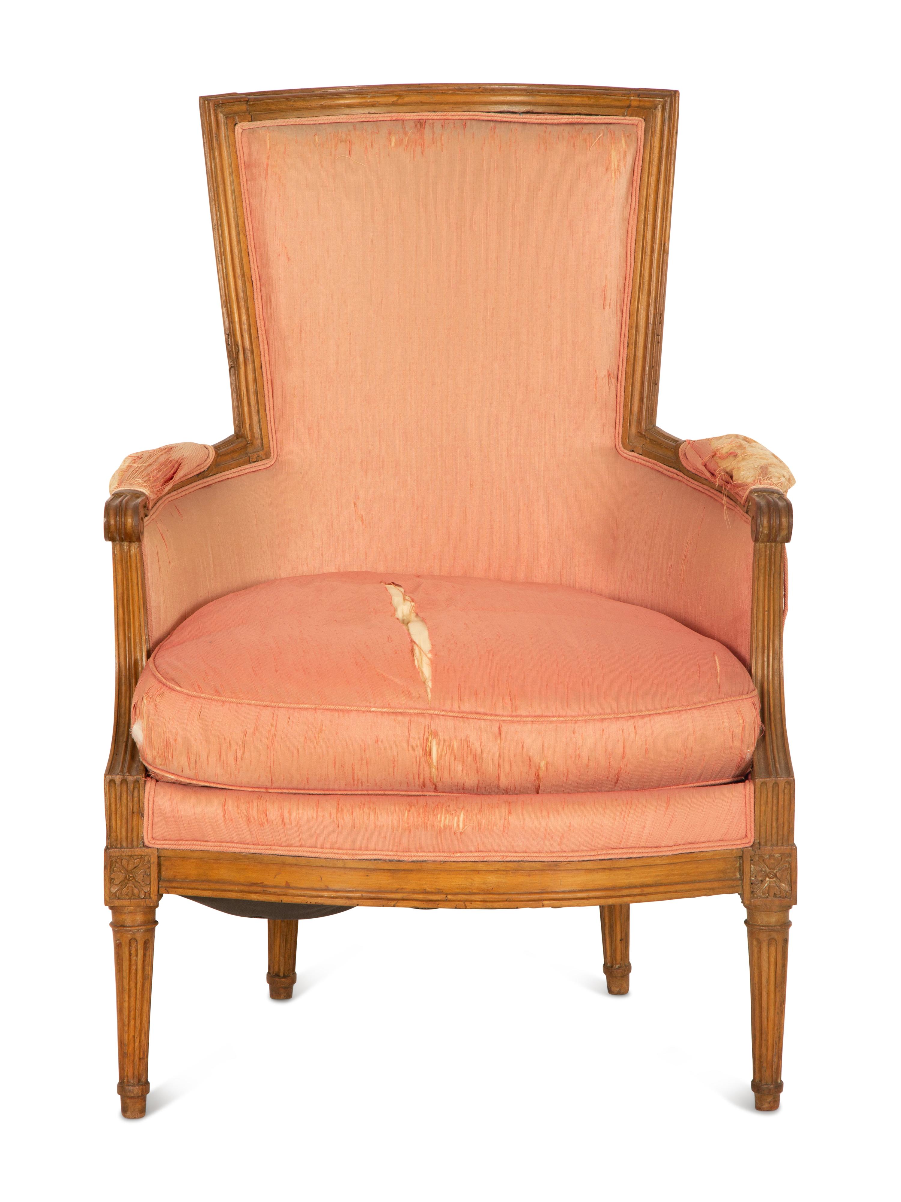 A Louis XVI Carved Walnut Bergère
