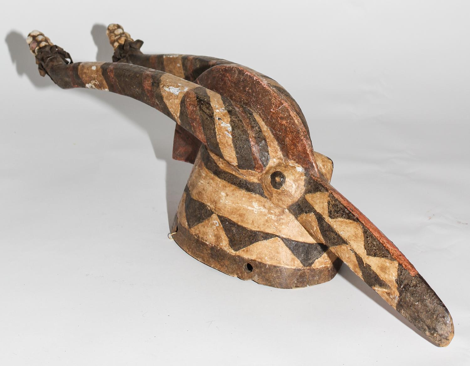A Guro Polychromed Wood Mask. Height 26 inches.