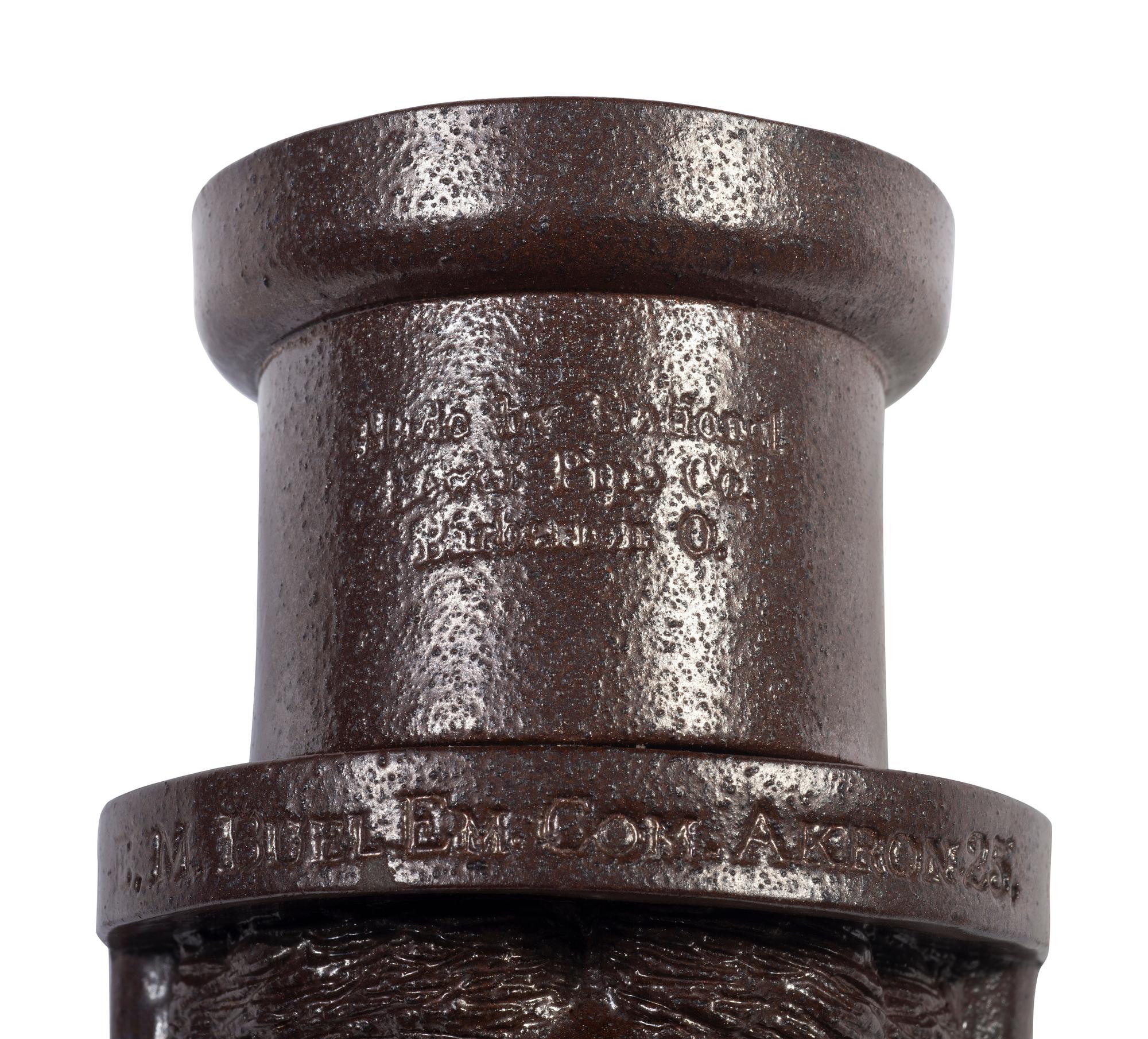 A Glazed Sewer Tile 'Liberty Head' Hanging Match Holder