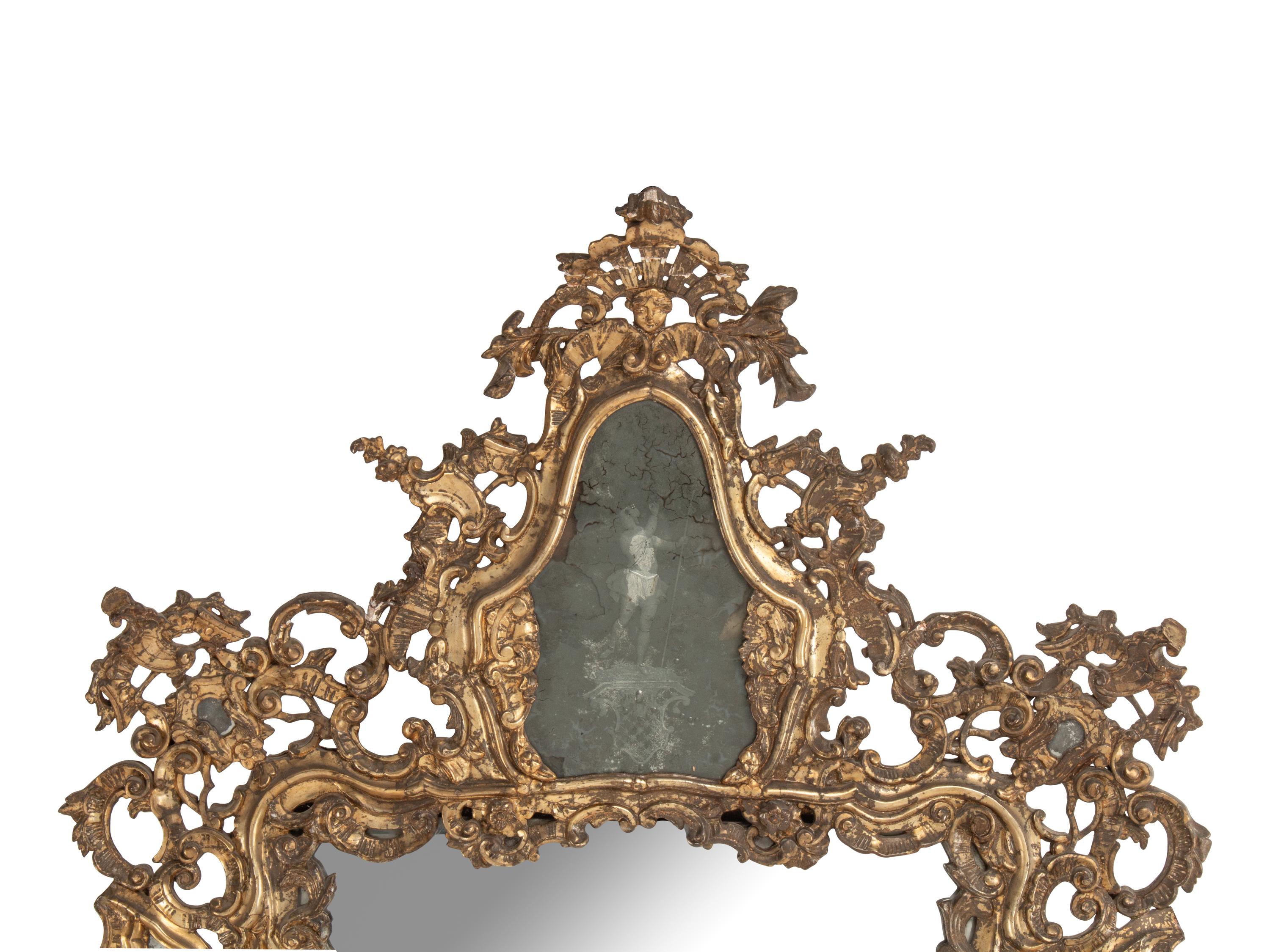 An Italian Silvered Wood and Etched Glass Mirror