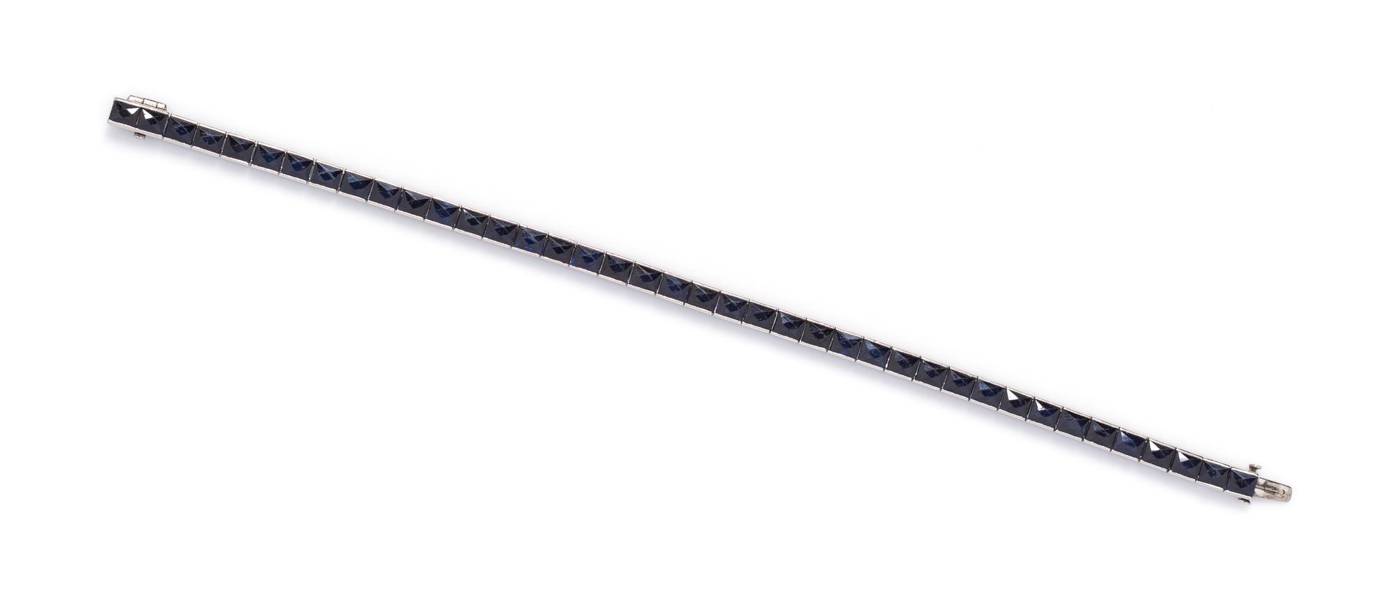 A Platinum and Sapphire Line Bracelet, 14.00 dwts.