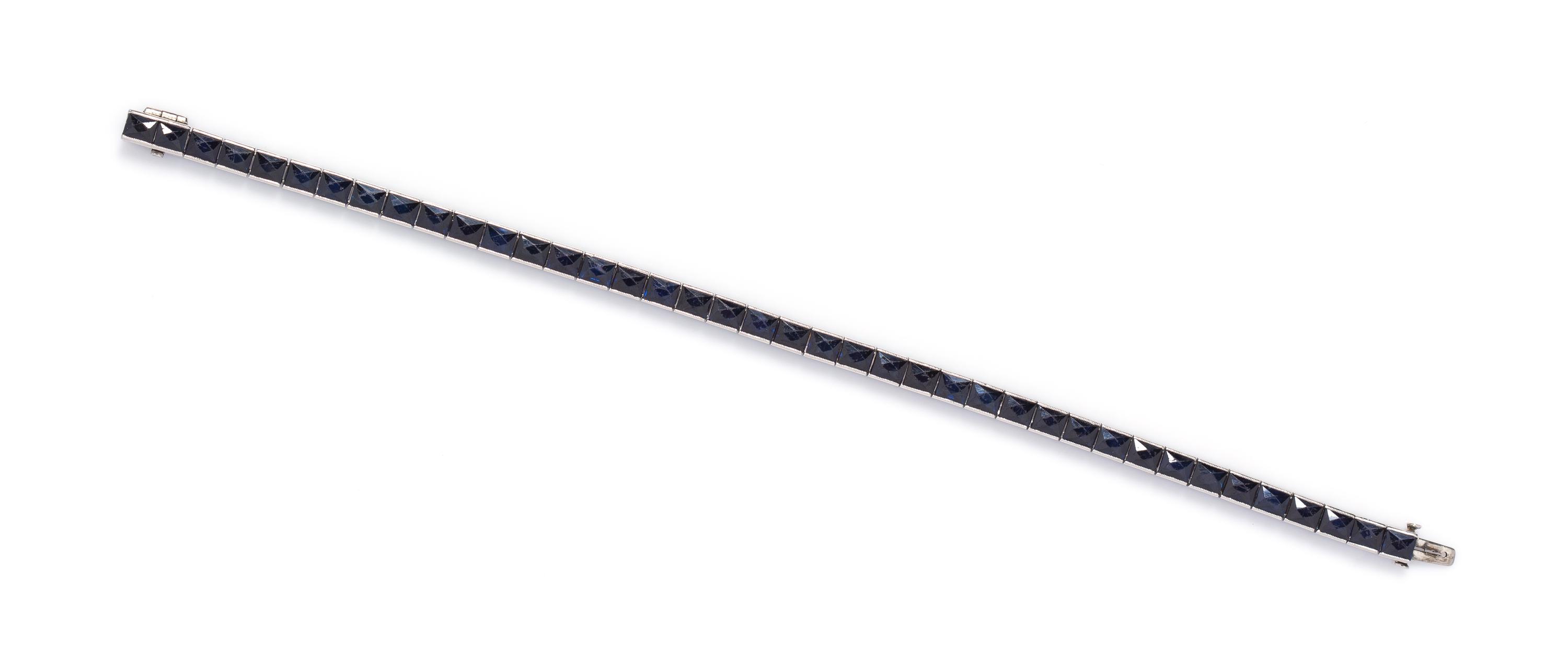 A Platinum and Sapphire Line Bracelet, 14.00 dwts.
