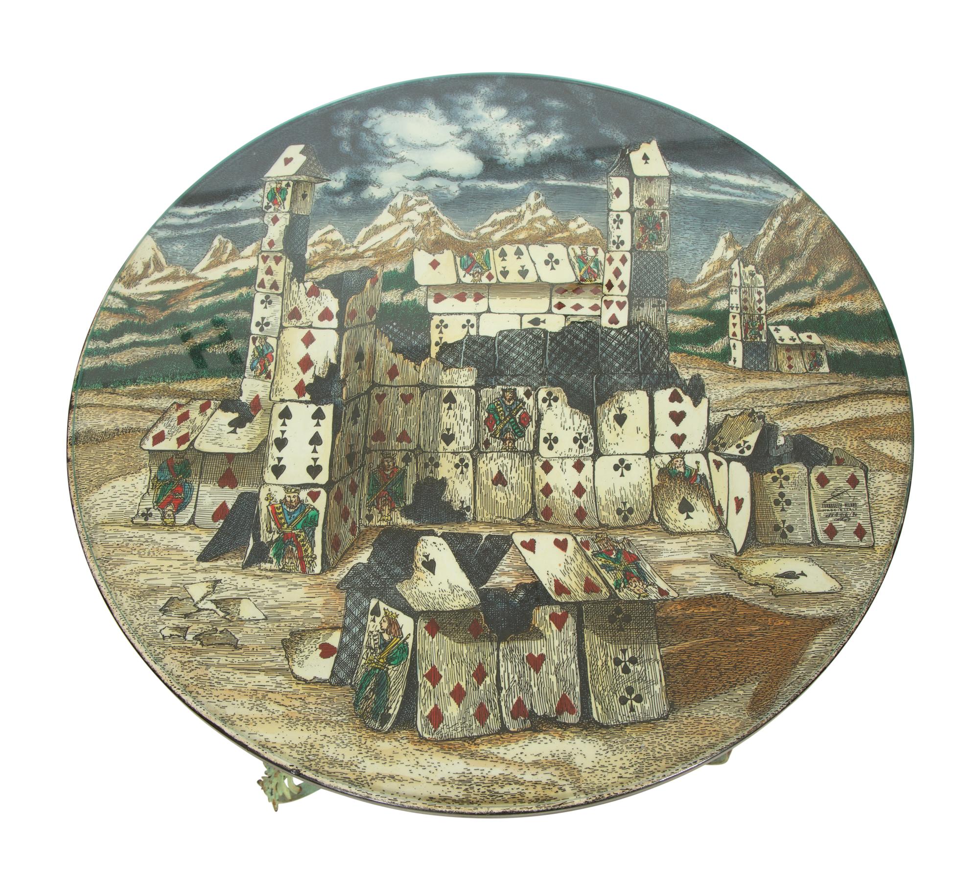 A Fornasetti Citta di Carte Table Top on Painted Wrought Iron Base