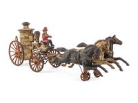 A Cast Iron Fire Engine Three-Horse Train and a Horse Pull Toy