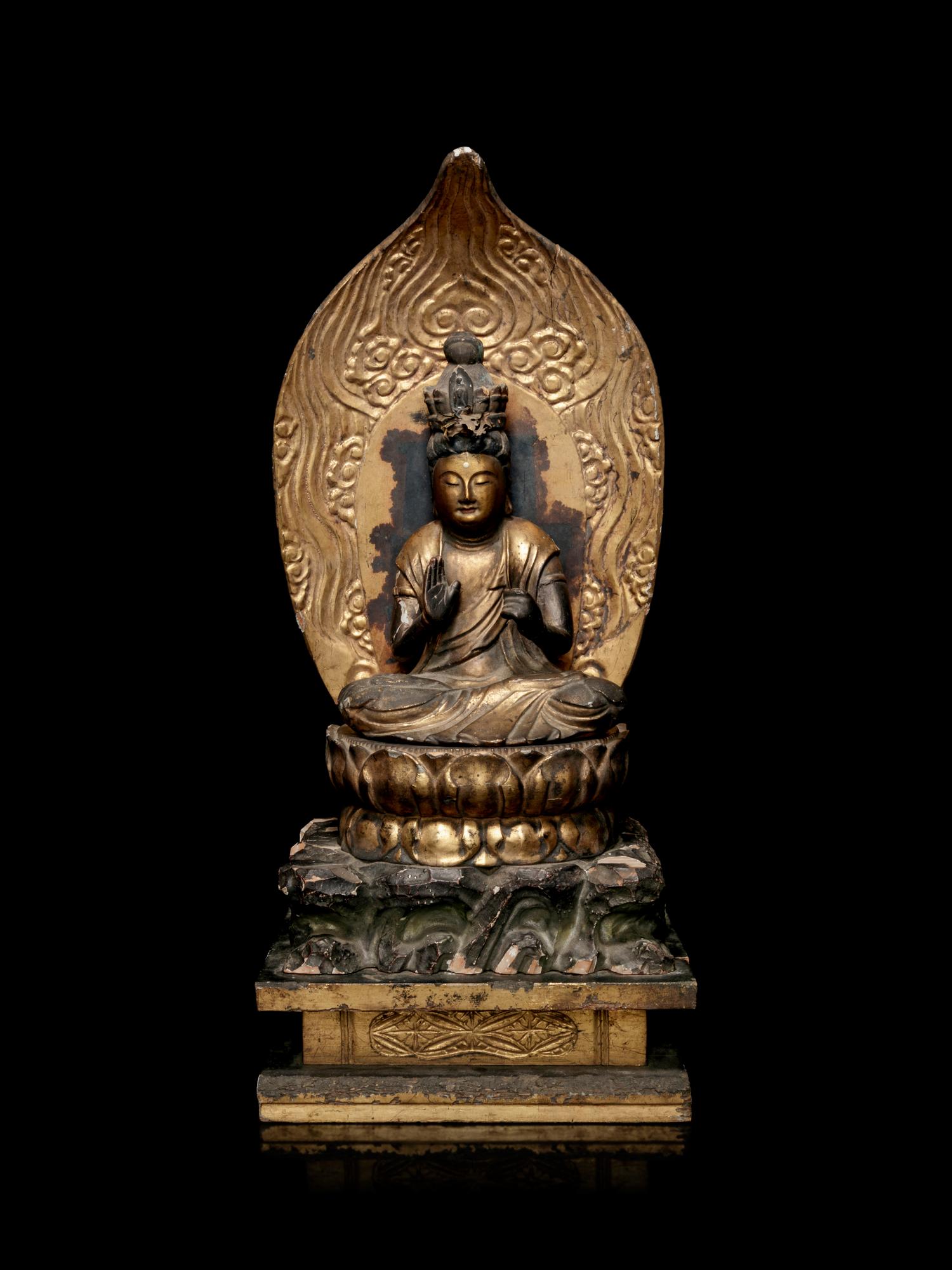 A Gilt Lacquered Wood Figure of Seated Kannan