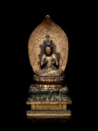 A Gilt Lacquered Wood Figure of Seated Kannan