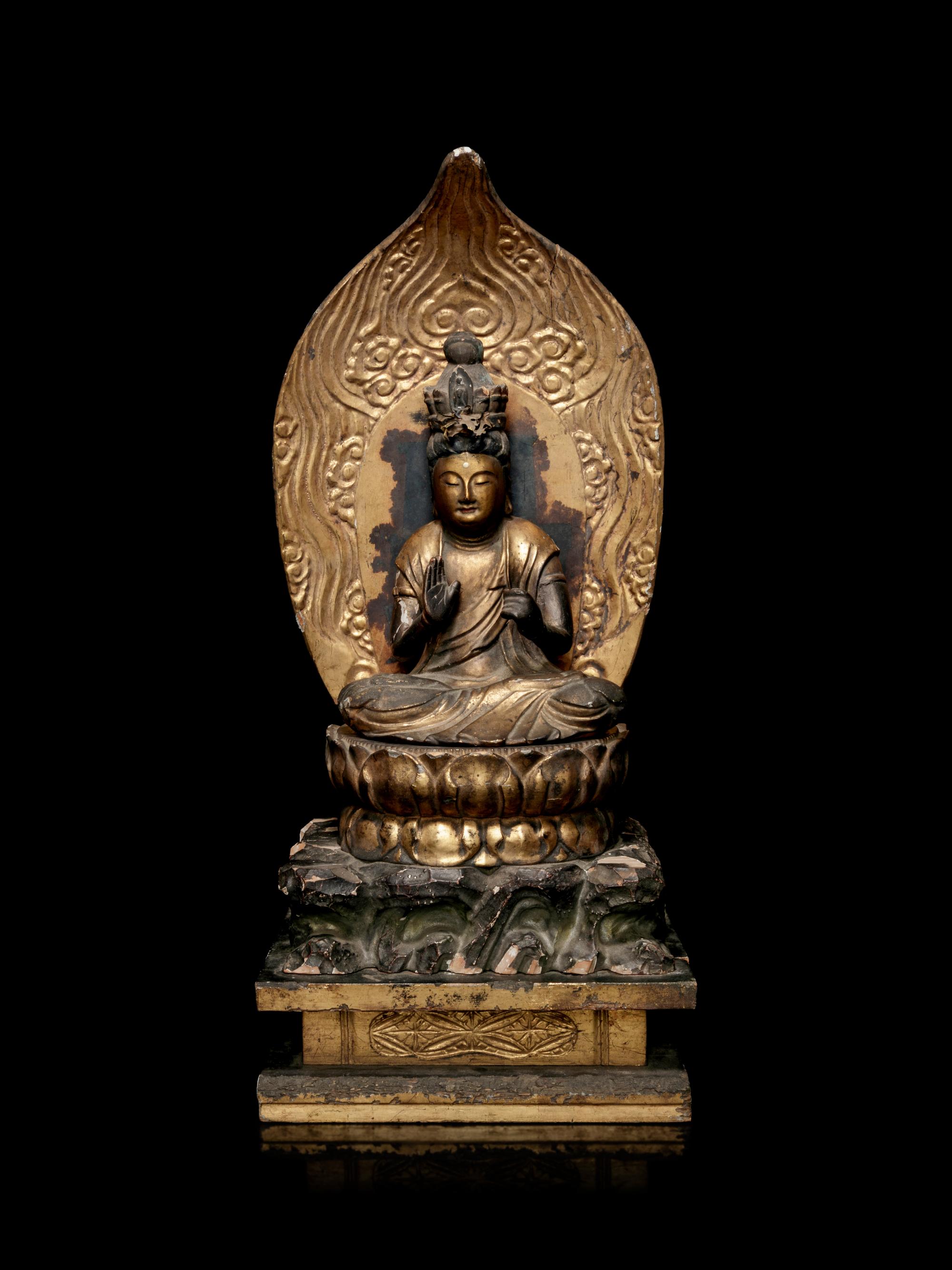 A Gilt Lacquered Wood Figure of Seated Kannan