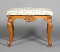 A Renaissance Revival Bench, Height 19 1/2 x width 25 1/2 x depth 17 inches.