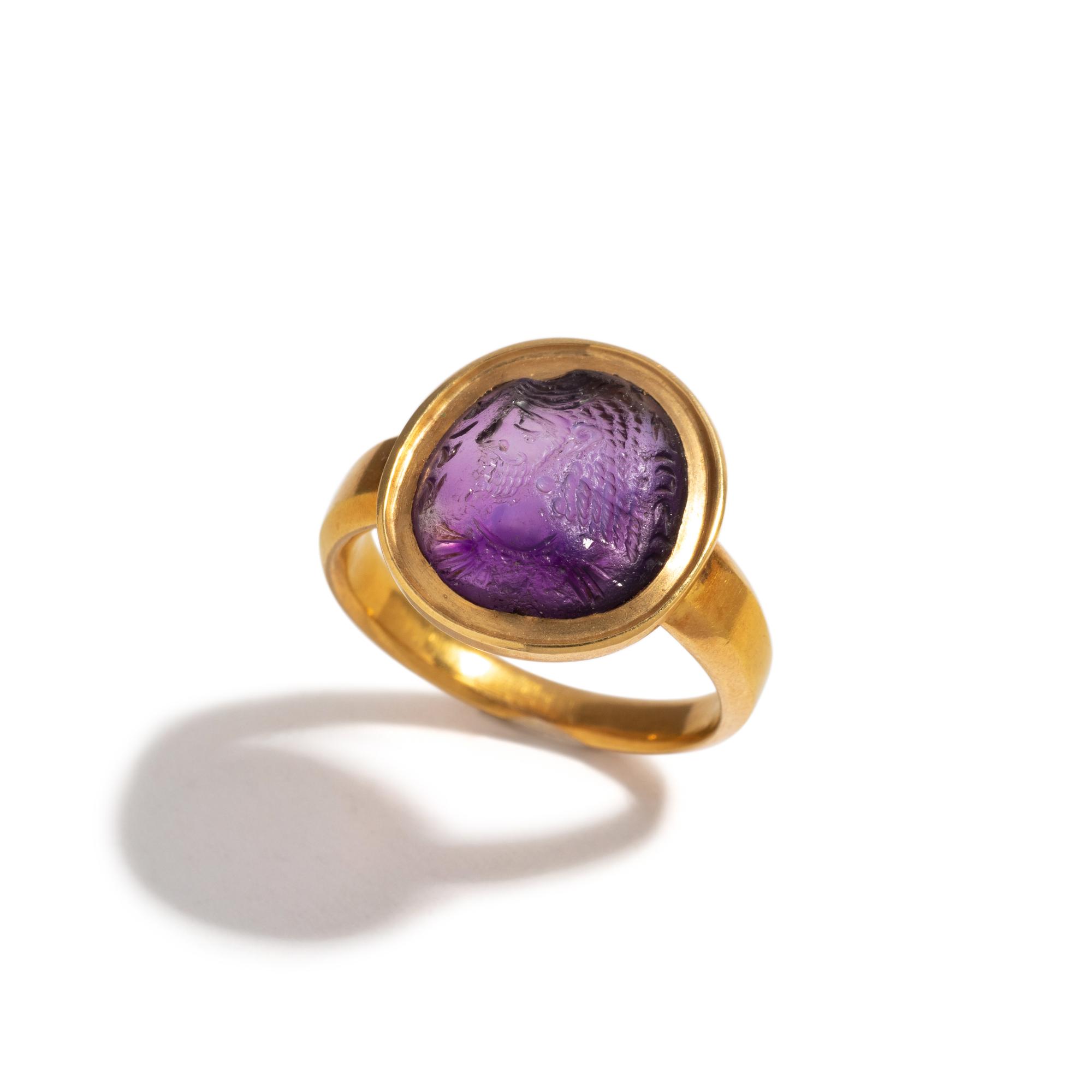 A Sasanian Amethyst Ring Stone with a Royal Portrait and Pahlavi Inscription — Set in a gold ring