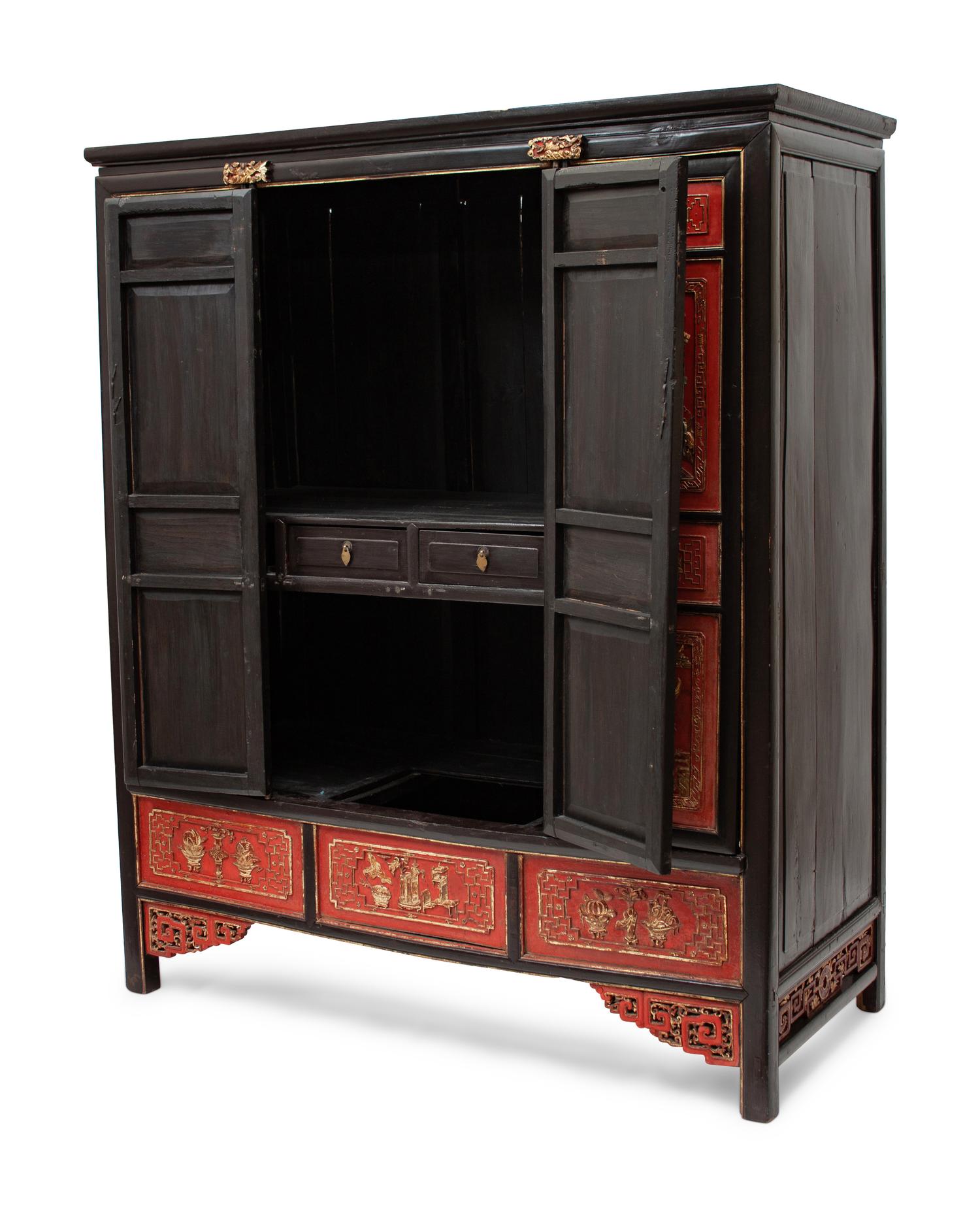 A Chinese Export Parcel Gilt and Red Lacquered Cabinet