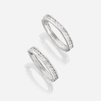 A pair of diamond and fourteen karat white gold earrings