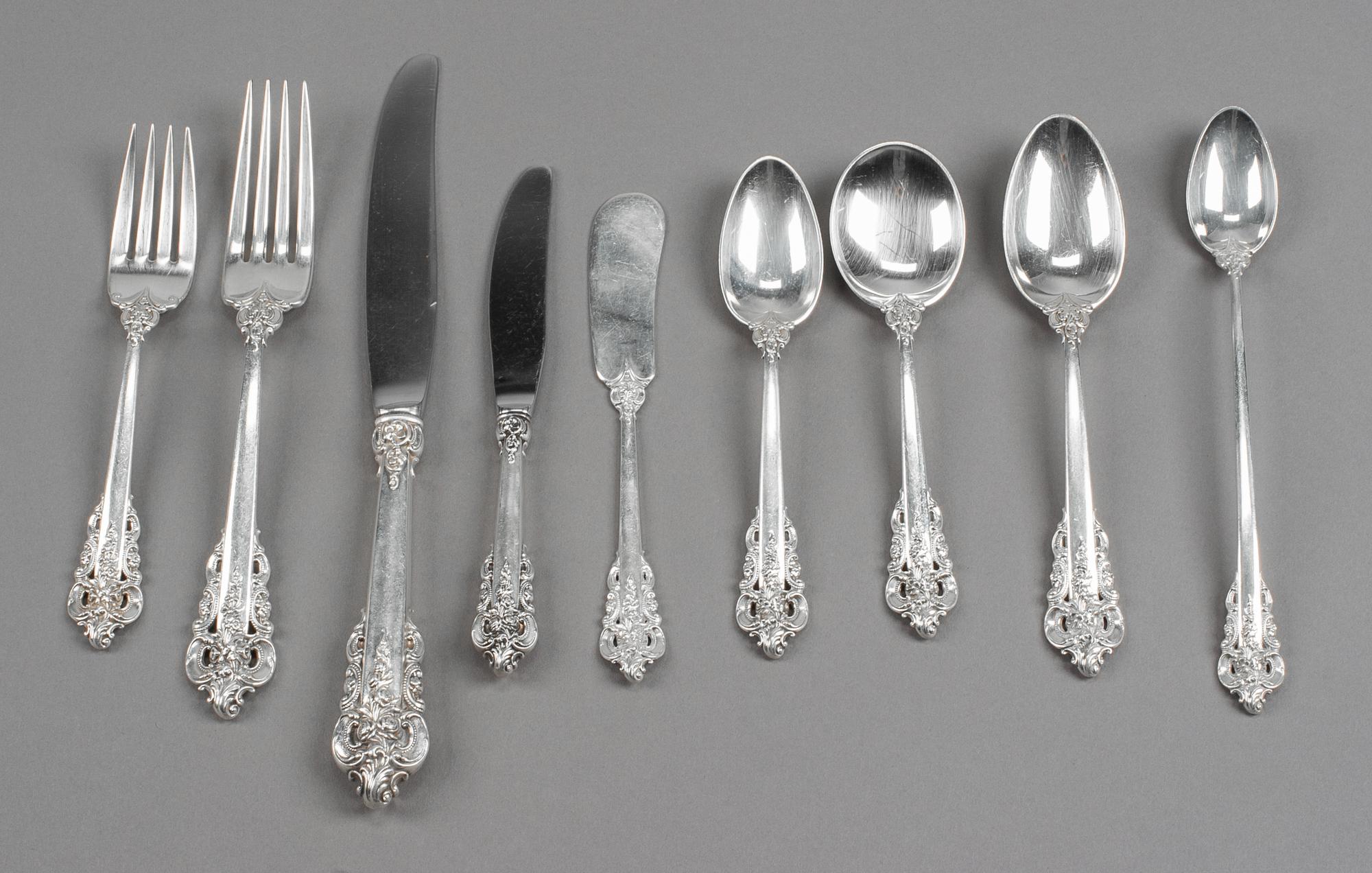 An American Silver Flatware Service, Wallace Silversmiths, Wallingford, CT, Grand Baroque pattern, comprising: 8 dinner knives 12 desse