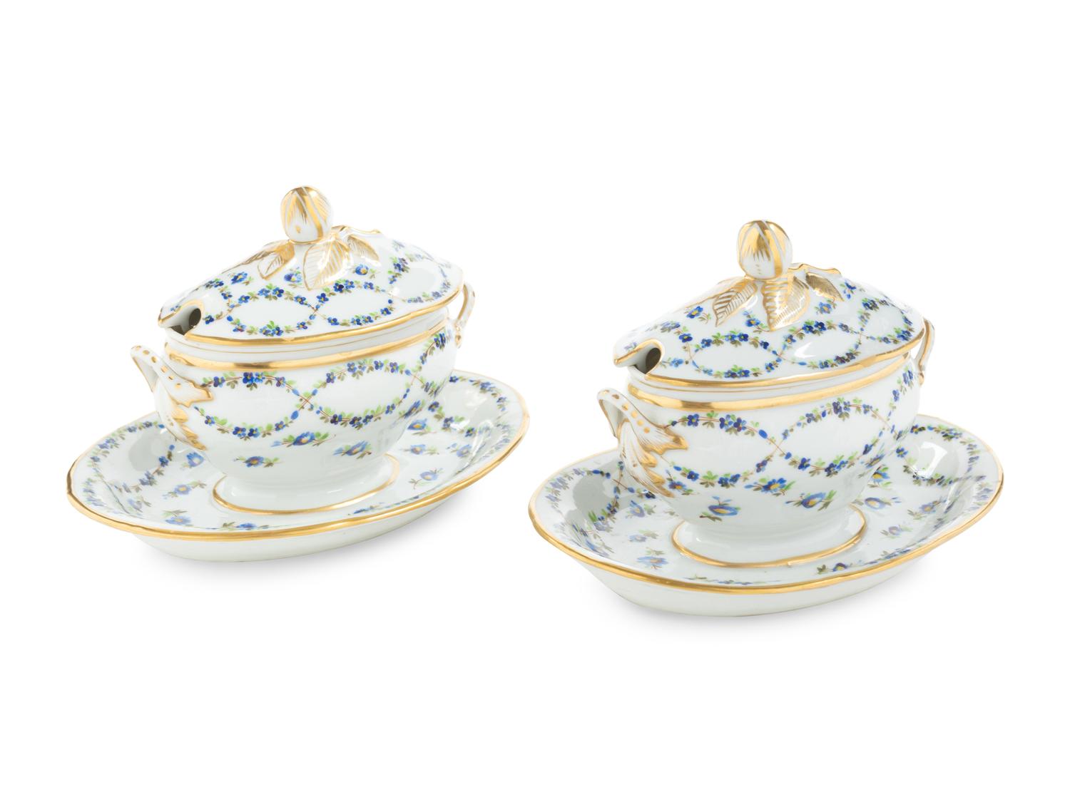 A Pair of English Porcelain Covered Sauce Tureens with Attached Underplates