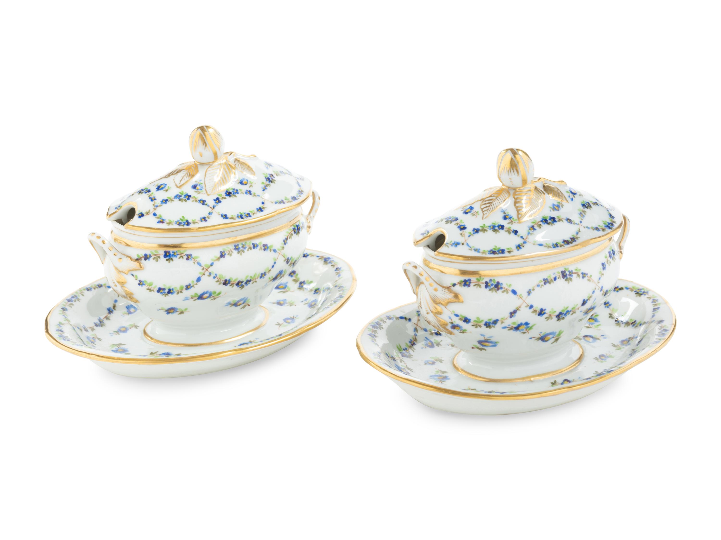 A Pair of English Porcelain Covered Sauce Tureens with Attached Underplates