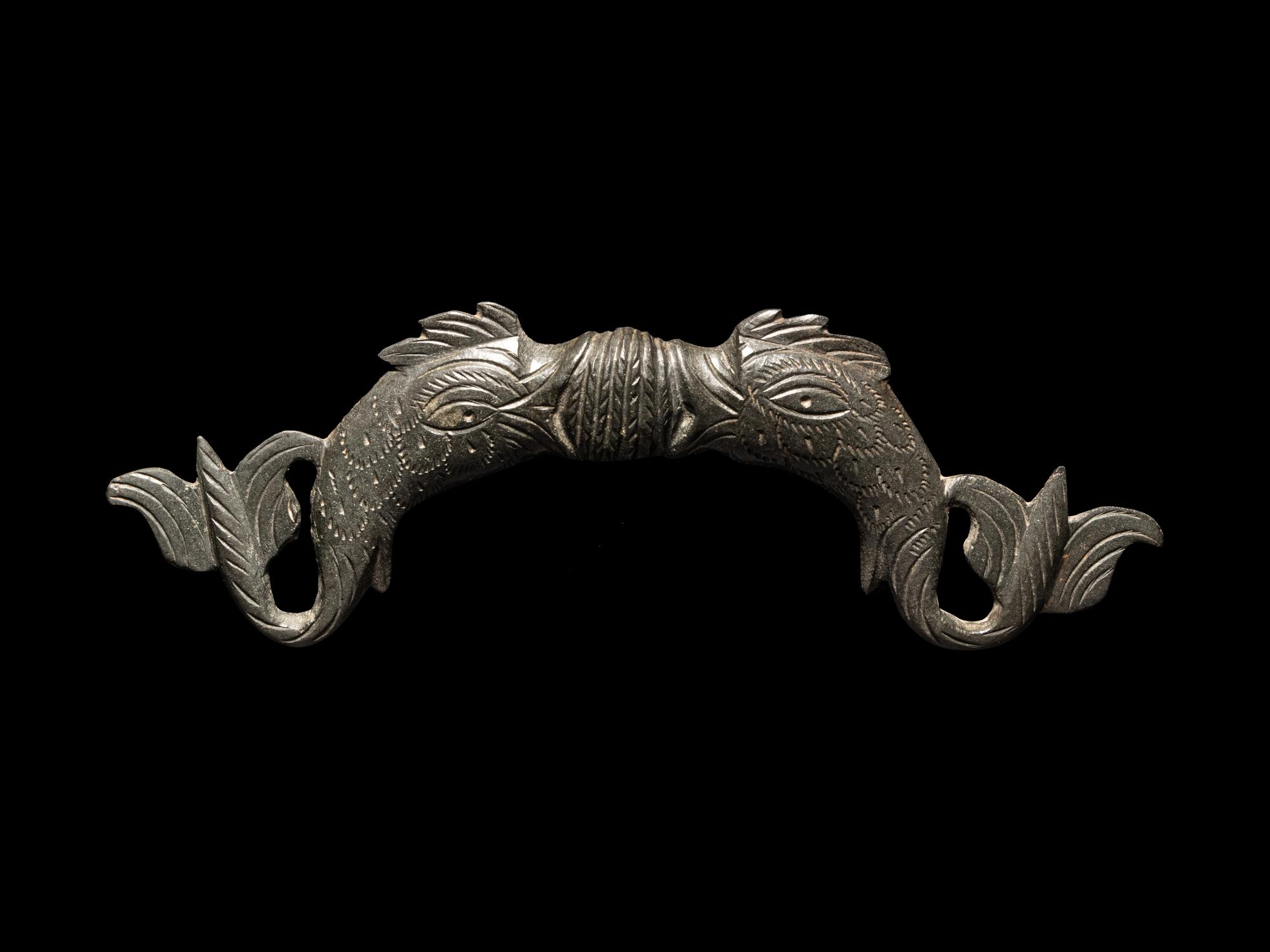 A Roman Bronze Double-Dolphin Handle
