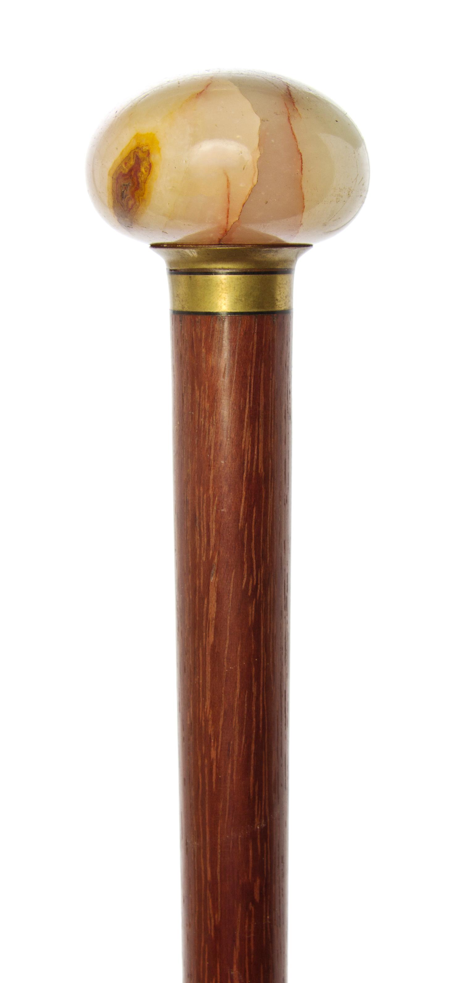 An American Onyx Handled Walking Stick, Width of handle 1 7/8 x length overall 36 inches.