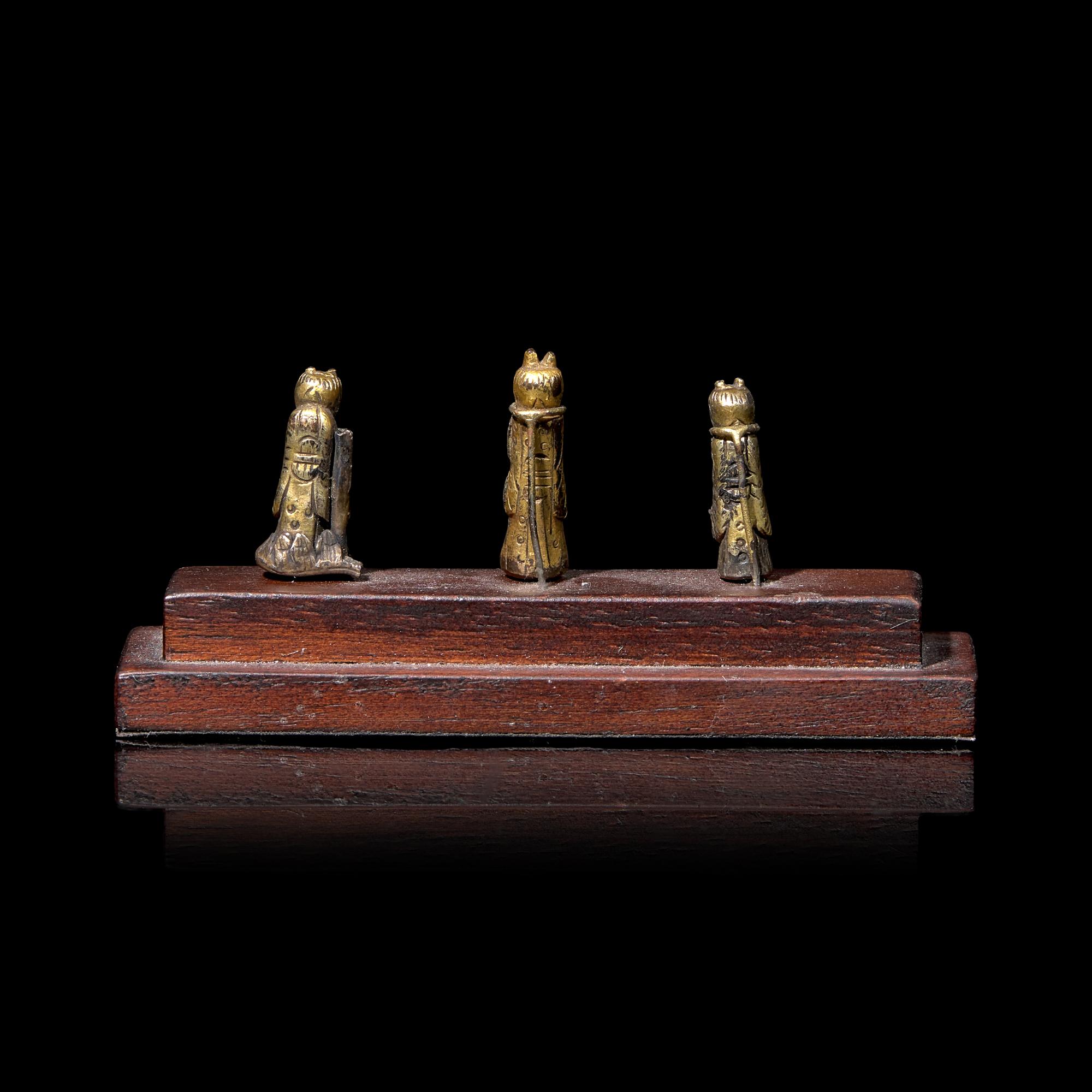 An Unusual Group of Three Chinese Gilt Bronze Miniature Deities, Ming Dynasty 明 銅鎏金袖珍小佛一組三件