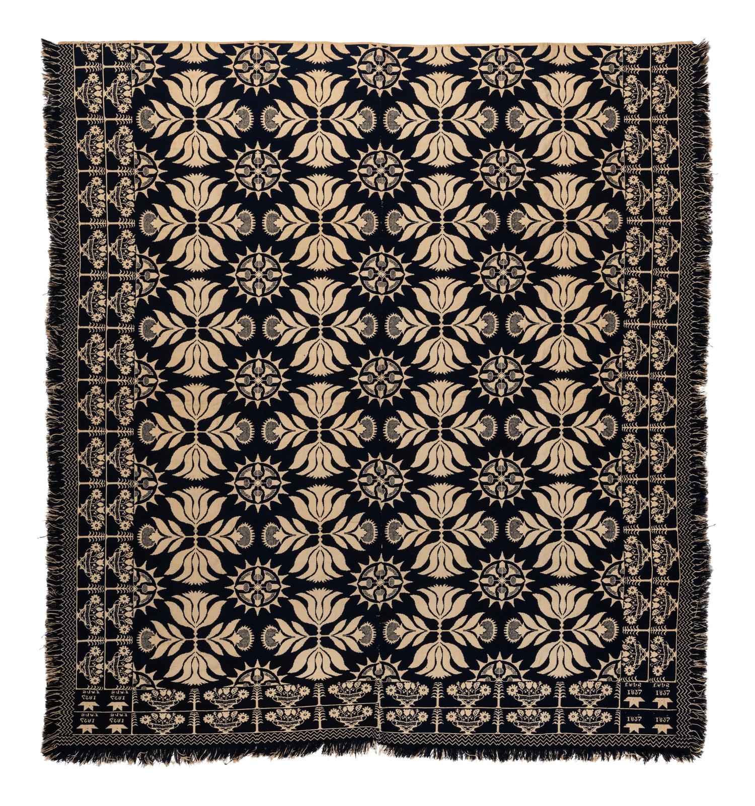 A Blue and White Flowering Urn, Sun and Acorn Pattern Jacquard Coverlet