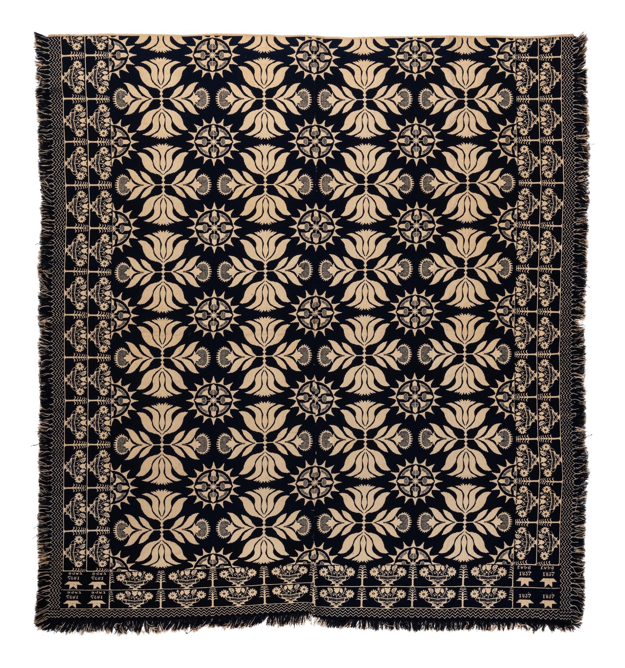 A Blue and White Flowering Urn, Sun and Acorn Pattern Jacquard Coverlet
