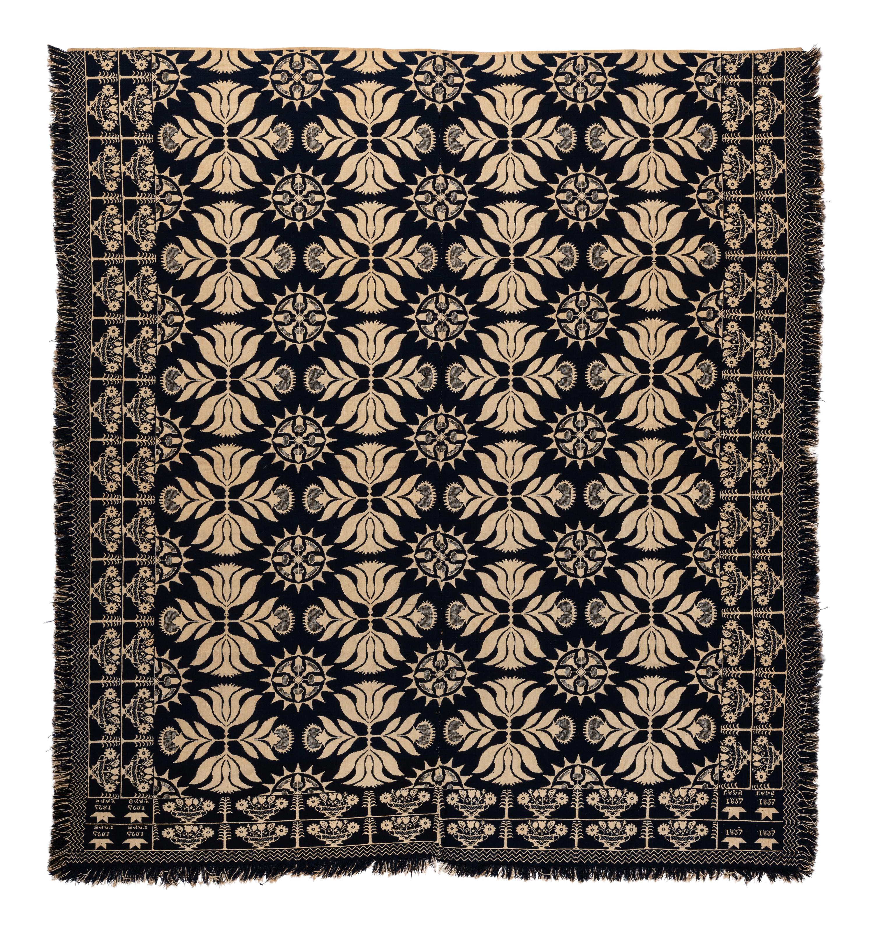 A Blue and White Flowering Urn, Sun and Acorn Pattern Jacquard Coverlet