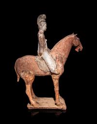 A Pair of Chinese Pottery Equestrian Figures