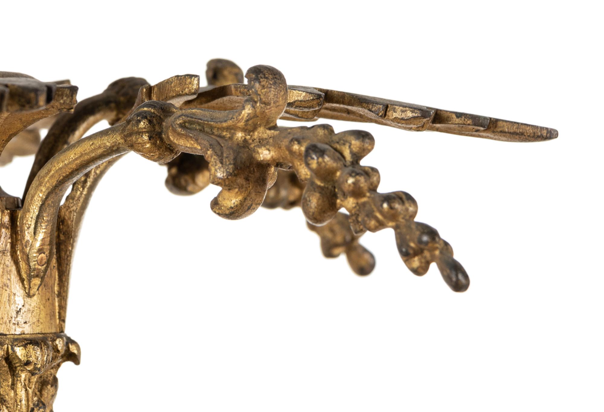 A Louis XVI Style Gilt Bronze Sixteen-Light Chandelier