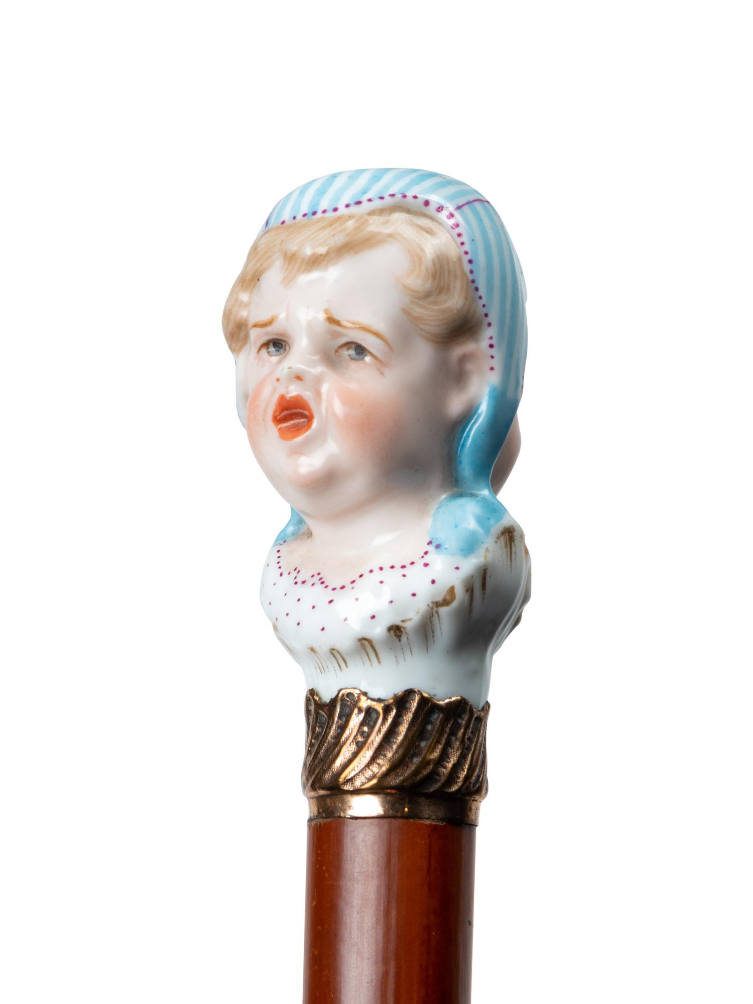 A French Figural Porcelain and Gilt Metal Mounted Cane