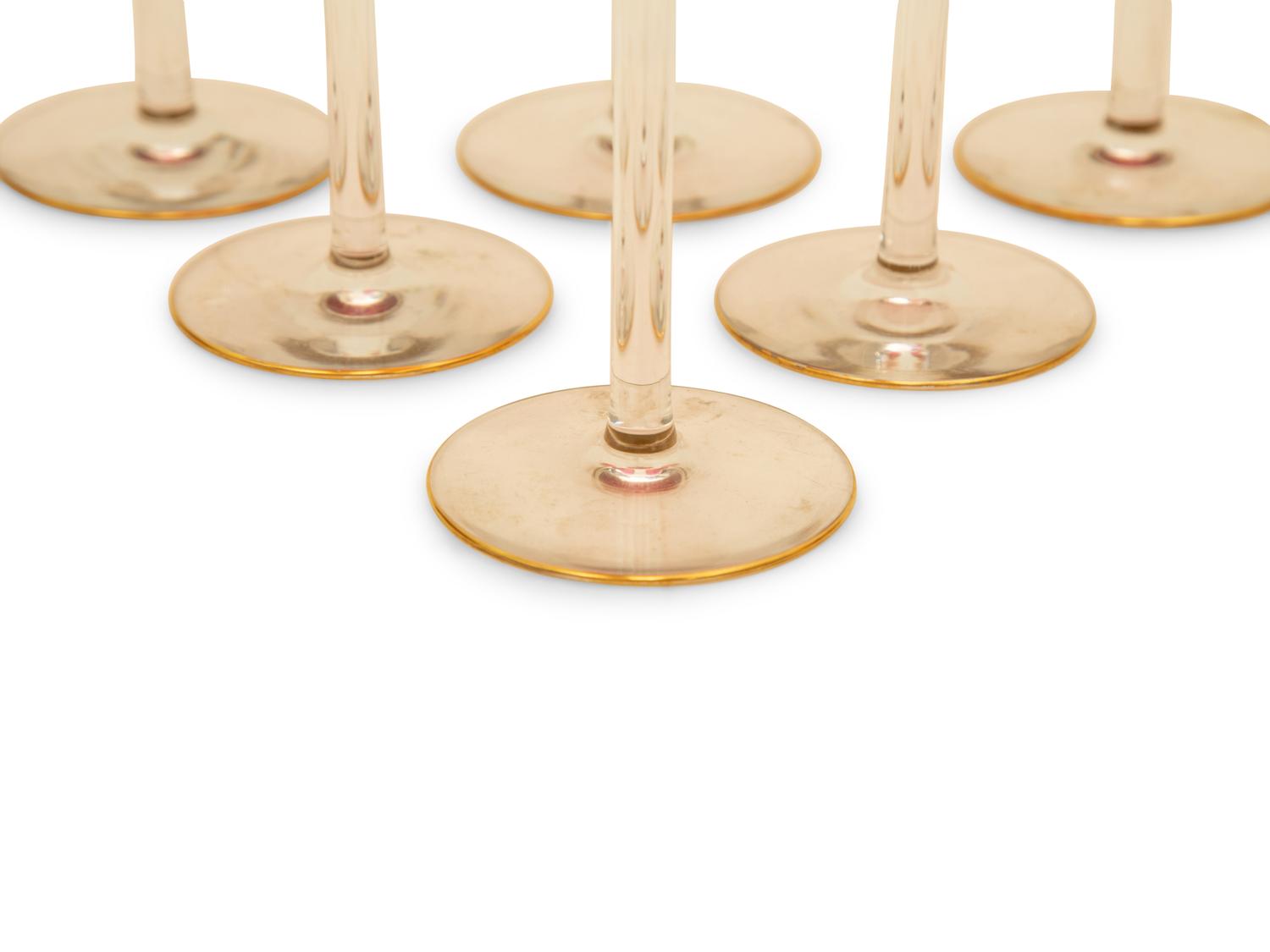 A Set of Twelve Bohemian Gilt Decorated Cranberry Glass Stemmed White Wines — 19th/20th Century