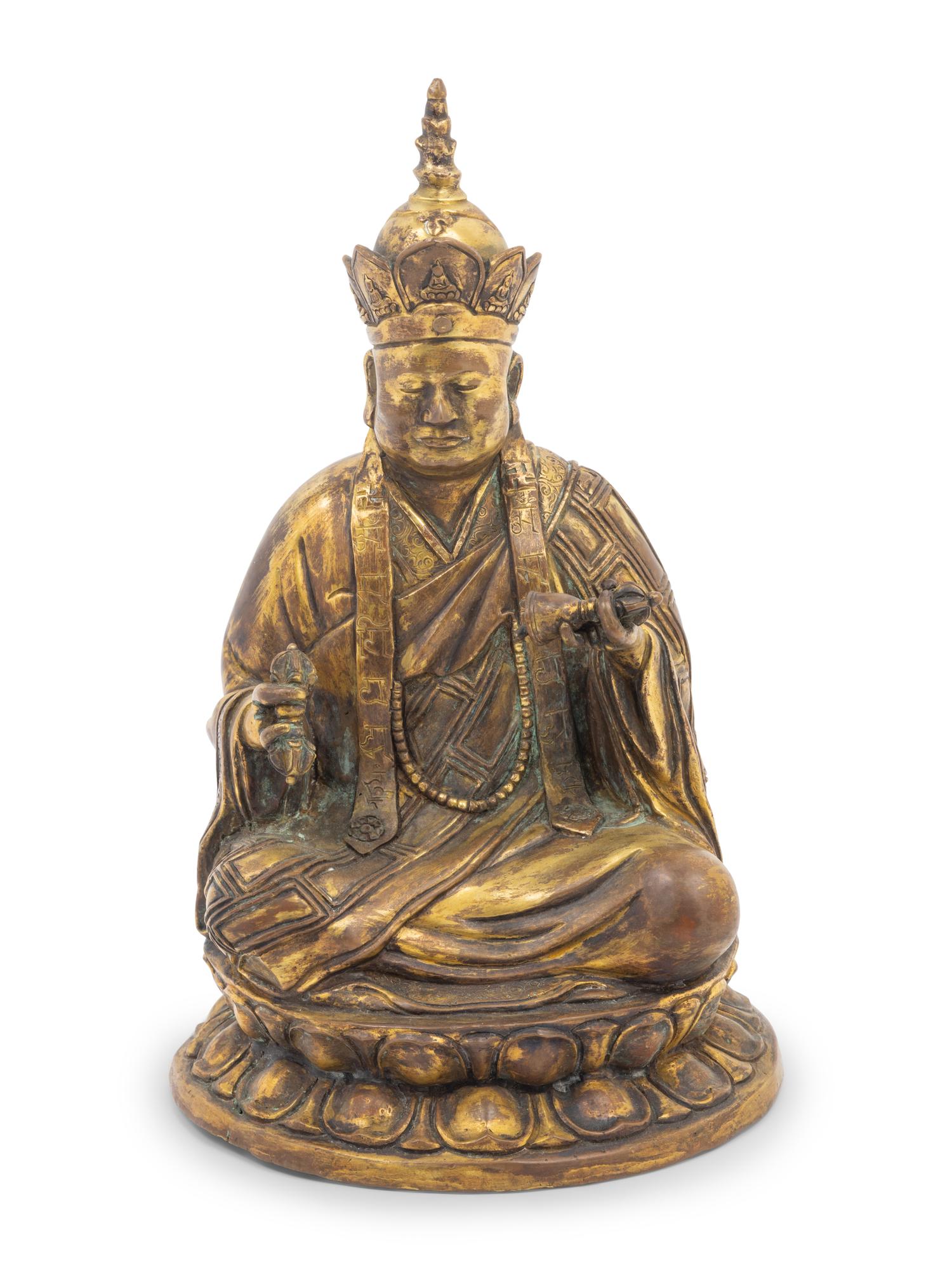A Tibetan Gilt Bronze Figure of a Seated Guru