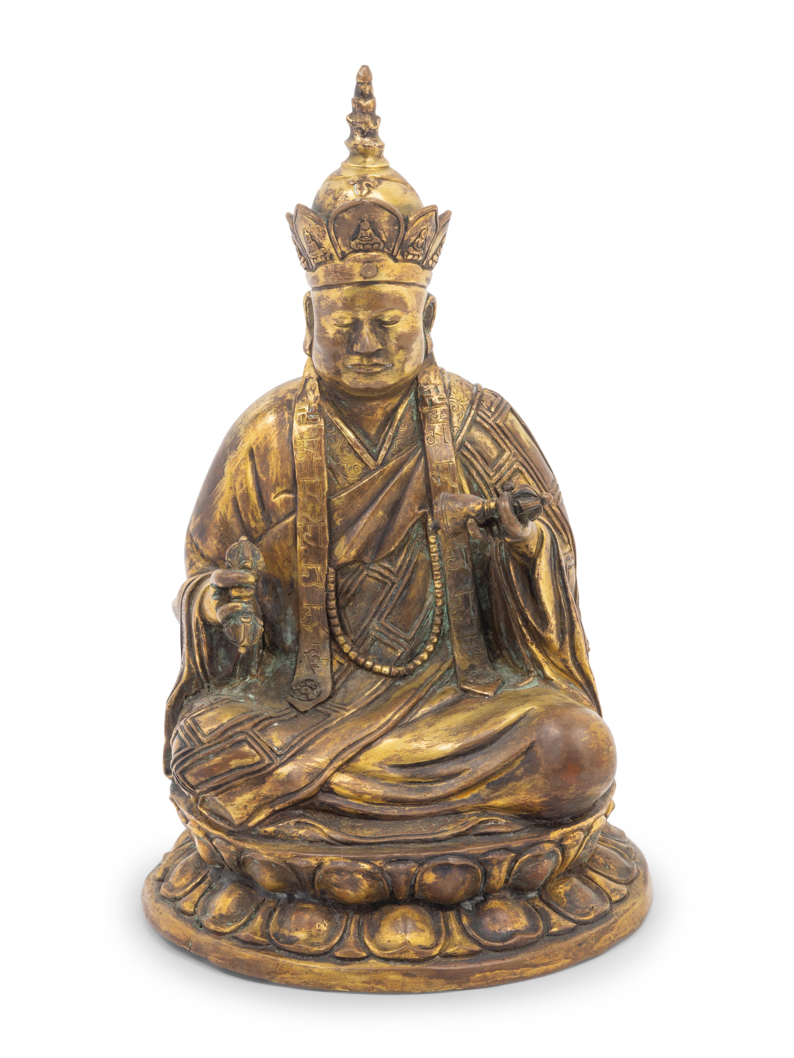 A Tibetan Gilt Bronze Figure of a Seated Guru