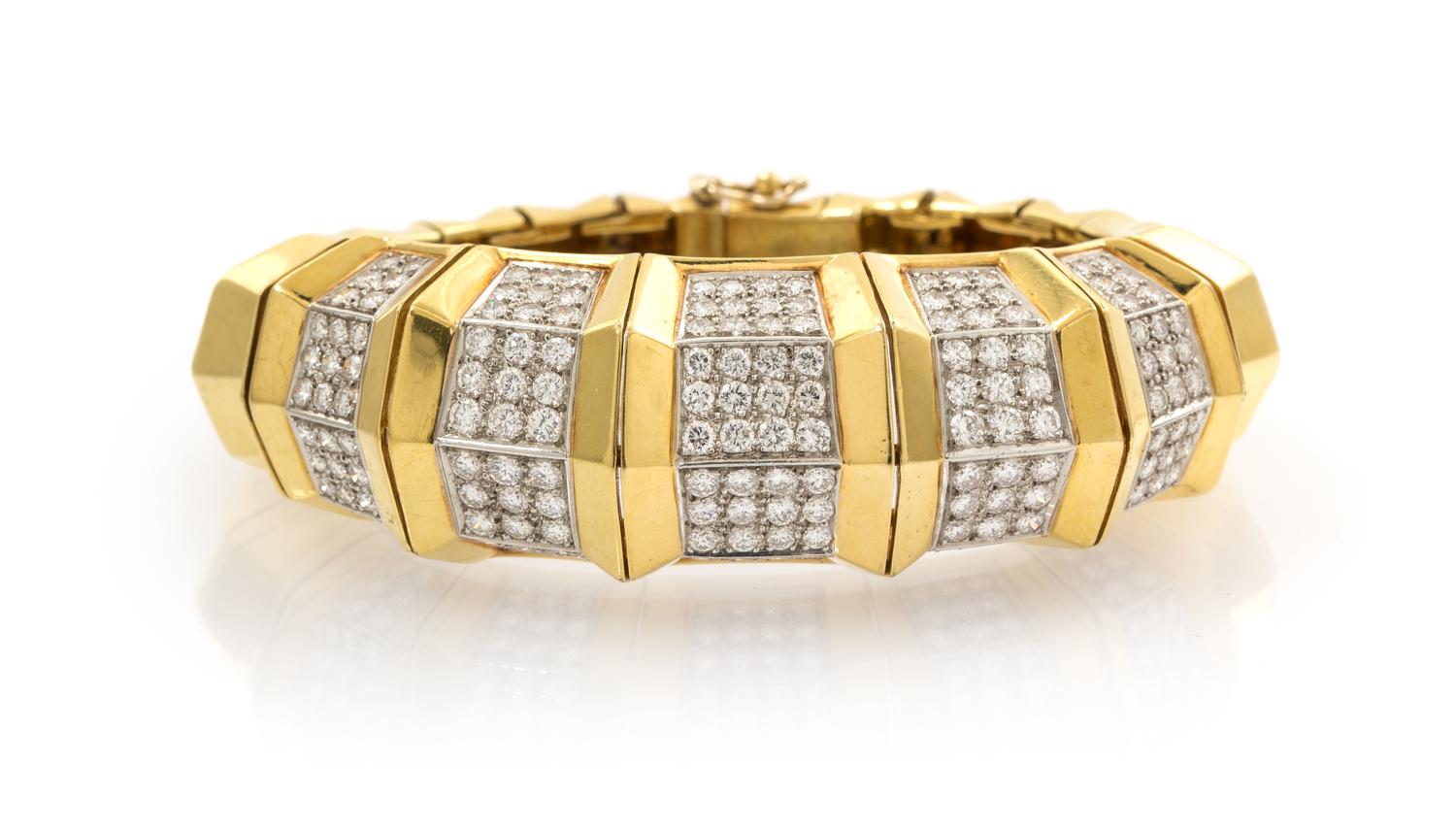 An 18 Karat Yellow Gold and Diamond Bangle Bracelet, 71.00 dwts.