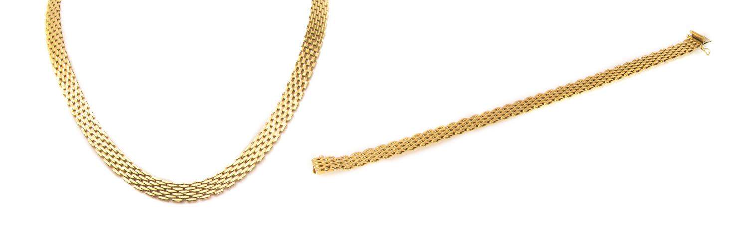 An 18 Karat Yellow Gold Panther Chain Demi Parure, 36.40 dwts.