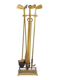 A Set of Gilt Metal and Iron Golf Club Fire Tools and Stand