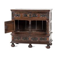 A Flemish Paneled and Molded Oak Chest of Drawers