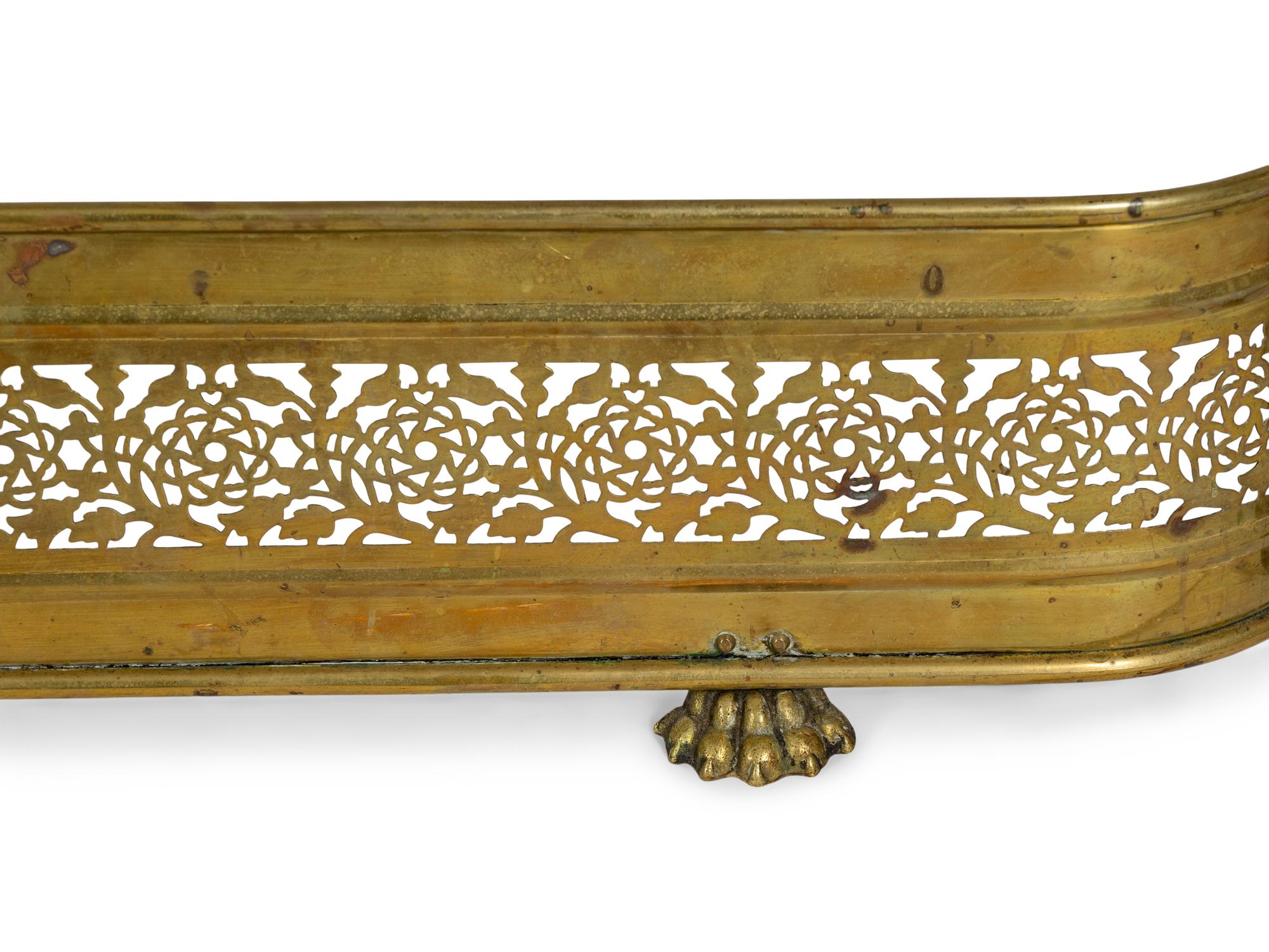 A Group of Federal and Classical Style Brass and Iron Fireplace Accessories