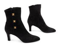 Three Pairs of Designer Boots: One Chanel, One Prada, One Celine