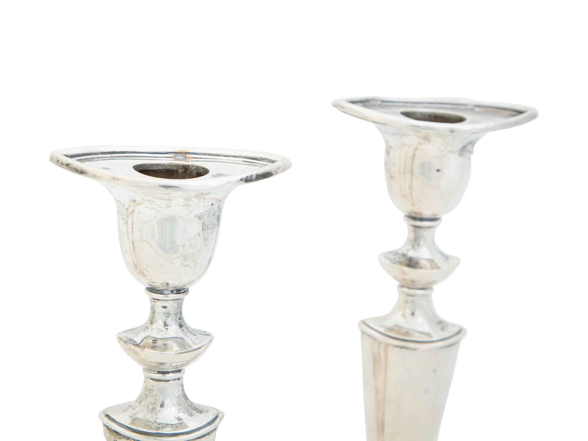 Four English Silver Weighted Candlesticks