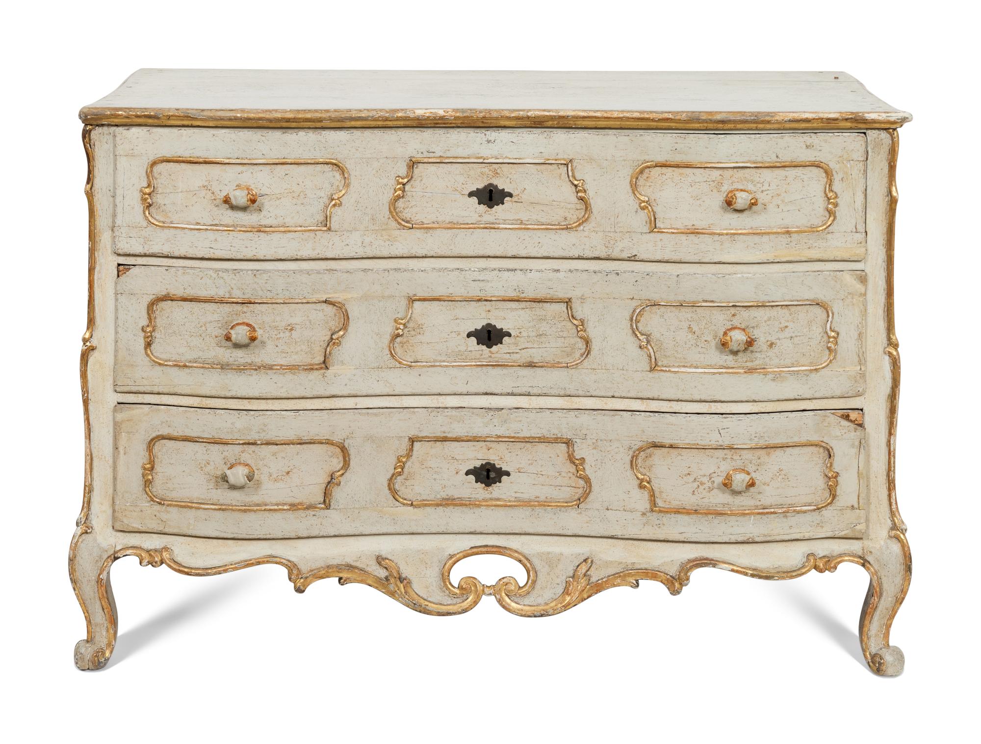 An Italian Rococo Cream-Painted and Parcel Gilt Commode