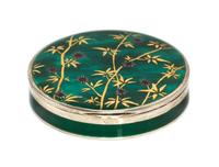 A Continental Silver and Enamel Compact, Import Mark C&C, London, 1925, of circular form, the lid with gilt and red foliate elements on