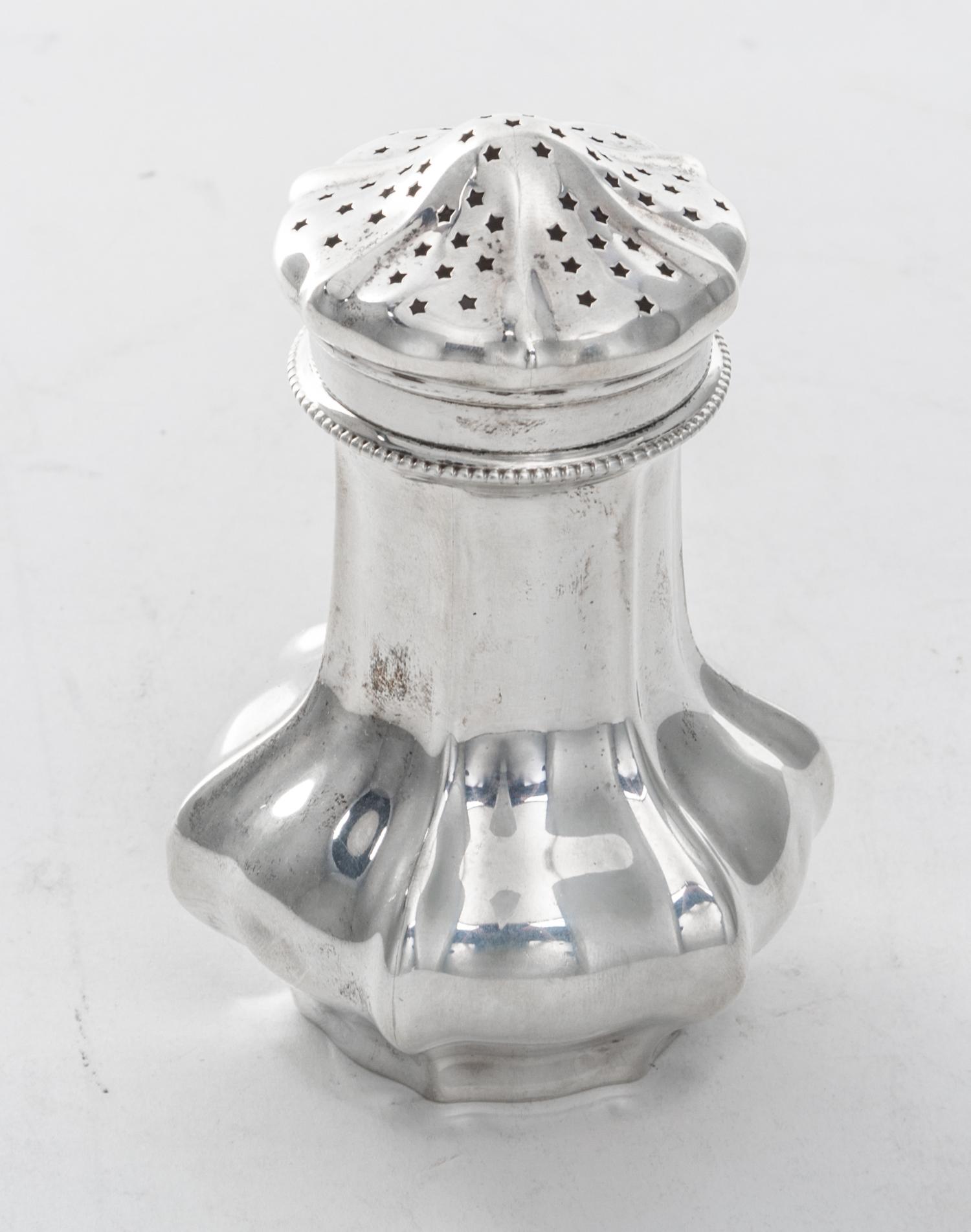 An American Silver Sugar Caster, Reed & Barton, Taunton, MA, 20th Century, of paneled baluster form.
