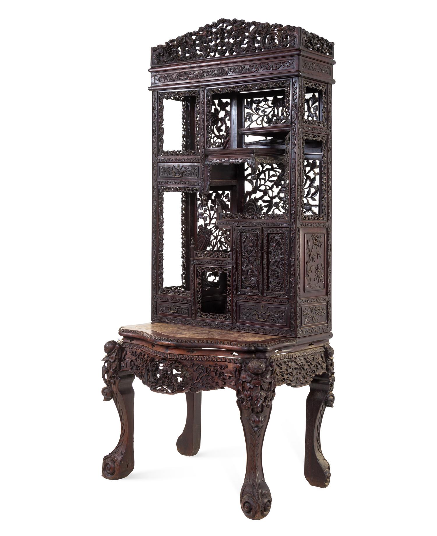 A Chinese Export Carved Hardwood Displaying Cabinet and Desk
